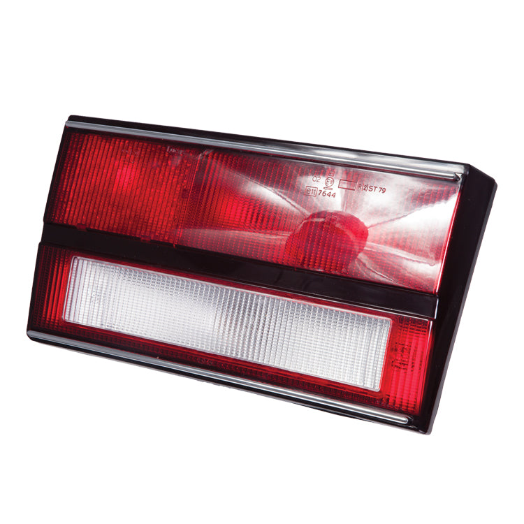 Lucas L945 Rear Lamp LH. Rear Inboard Stop / Reverse Lamp - Left hand. Red/clear